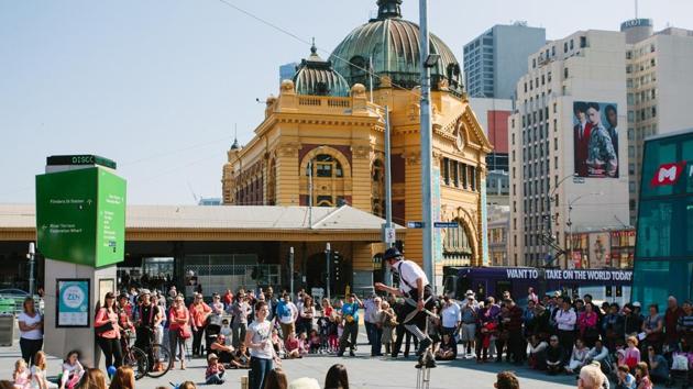 Melbourne in Australia came second. Seen here are street performers in Federation Square in the city. (AFP)