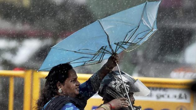 A motorcyclist rides through heavy rains in Chennai on Thursday. (PTI Photo) A motorcyclist rides through heavy rains in Chennai on Thursday. (PTI Photo)