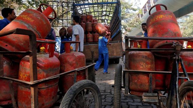 A file picture of workers loading liquefied petroleum gas (LPG) cooking cylinders onto a supply truck in Mumbai. (Reuters) A file picture of workers loading liquefied petroleum gas (LPG) cooking cylinders onto a supply truck in Mumbai. (Reuters)