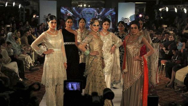Models present creations by local designers of label Nauratan during a fashion show in Peshawar, Pakistan. (AP) Models present creations by local designers of label Nauratan during a fashion show in Peshawar, Pakistan. (AP)