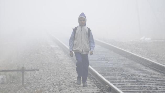 Unmindful of the danger, a school student walks next to railway tracks in Baradari area of in Patiala on Friday. (Bharat Bhushan/HT)