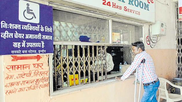 A differently-abled man stands at the enquiry section at Sarwate bus stand in Indore.(Shankar Mourya/HT Photo)