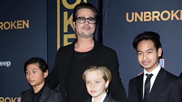 This file photo taken on December 15, 2014 shows actor Brad Pitt and children Pax Jolie-Pitt (L), Shiloh Jolie-Pitt (C) and Maddox Jolie-Pitt. (AFP) This file photo taken on December 15, 2014 shows actor Brad Pitt and children Pax Jolie-Pitt (L), Shiloh Jolie-Pitt (C) and Maddox Jolie-Pitt. (AFP)