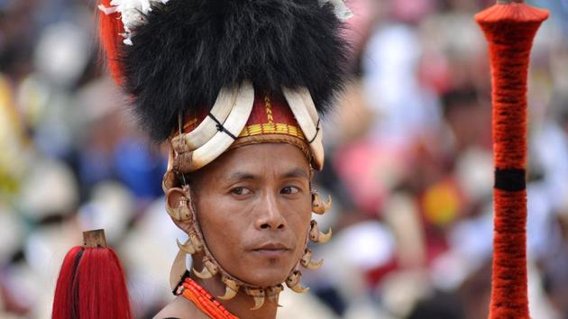 A Naga tribesman waits to perform a cultural dance at the opening day of the annual Hornbill Festival in Nagaland on Thursday. (PTI)