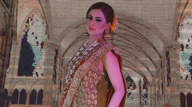 A model presents a creation by local designers of label Nauratan during a fashion show in Peshawar, Pakistan. (AP) A model presents a creation by local designers of label Nauratan during a fashion show in Peshawar, Pakistan. (AP)