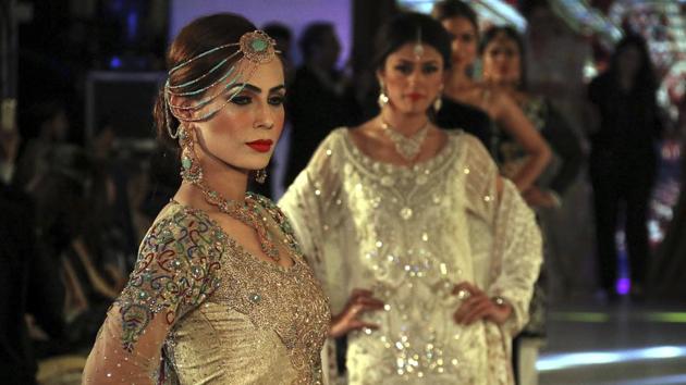 Models showcase creations by designers of label Nauratan during a fashion show in Peshawar. (AP) Models showcase creations by designers of label Nauratan during a fashion show in Peshawar. (AP)