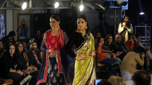 Models walk the ramp at a fashion show in Peshawar, Pakistan. The show aims to introduce new trends in the city. (AP) Models walk the ramp at a fashion show in Peshawar, Pakistan. The show aims to introduce new trends in the city. (AP)
