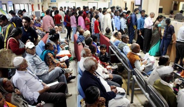 People queue up inside a bank to withdraw cash in Bhopal on Thursday. (PTI) People queue up inside a bank to withdraw cash in Bhopal on Thursday. (PTI)