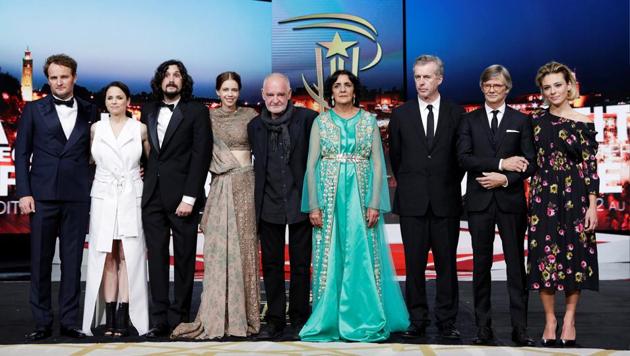 Jury members pose on stage during the opening ceremony of the 16th Marrakech International Film Festival in Marrakesh, Morocco, on Friday. (Reuters)