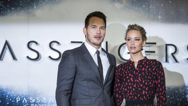Actors Chris Pratt and Jennifer Lawrence pose for photographers during a photo call to promote the film Passengers in London. (AP)