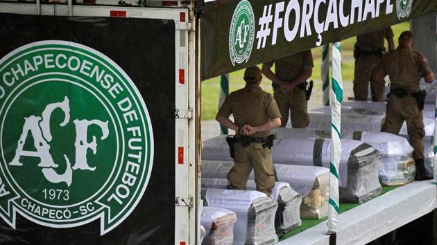 Soldiers carry the coffins of the members of the Chapecoense Real football club. The bodies of 50 players, coaches and staff from a arrived home Saturday for a massive funeral. (AFP) Soldiers carry the coffins of the members of the Chapecoense Real football club. The bodies of 50 players, coaches and staff from a arrived home Saturday for a massive funeral. (AFP)