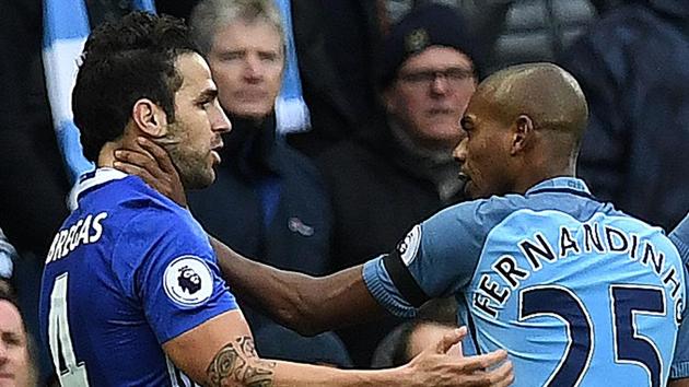 Manchester City's midfielder Fernandinho (right) grabs Chelsea's Cesc Fabregas following Manchester City's Argentinian striker Sergio Aguero's challenge on on defender David Luiz (AFP) Manchester City's midfielder Fernandinho (right) grabs Chelsea's Cesc Fabregas following Manchester City's Argentinian striker Sergio Aguero's challenge on on defender David Luiz (AFP)