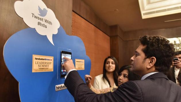 Sachin Tendulkar ‘tweets in’ on arrival at the Hindustan Times Leadership Summit at Taj Palace on Saturday. (Sanjeev Verma/HT PHOTO)