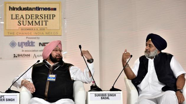 Deputy chief minister of Punjab Sukhbir Singh Badal and Congress leader Capt. Amarinder Singh during a discussion. (Arun Sharma/HT PHOTO)