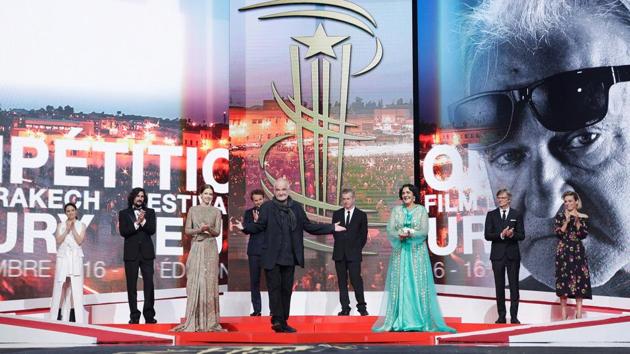 Jury members arrive on stage during the opening ceremony. The festival runs from December 2 to 10. (REUTERS)