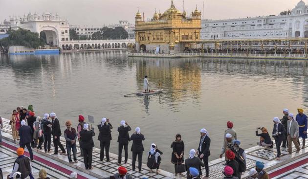 Delegates at the Heart of Asia meet clicking photos during a visit to the Golden Temple in Amritsar on Saturday. (Gurpreet Singh/HT)