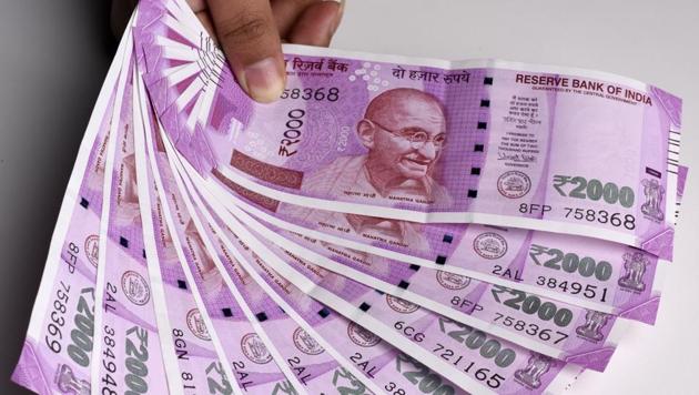 A farmer from Andhra Pradesh, was nabbed at Whitefield for illegally carrying Rs 12.10 lakh in Rs2,000 notes in a car to exchange them for old notes at 20% commission. (Sonu Mehta/Hindustan Times) A farmer from Andhra Pradesh, was nabbed at Whitefield for illegally carrying Rs 12.10 lakh in Rs2,000 notes in a car to exchange them for old notes at 20% commission. (Sonu Mehta/Hindustan Times)