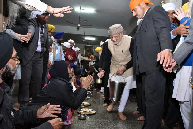 Modi also served Langar in the community kitchen of the shrine as Ghani stayed along with him. (PTI Photo)