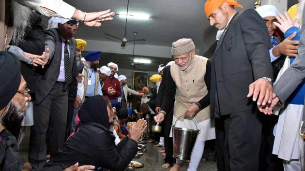 Prime Minister Narendra Modi serves langar during his visit at the Golden Temple in Amritsar on Saturday. (PTI)