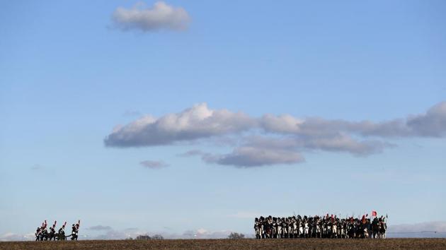 History enthusiasts dressed in regimental costumes prepare for a re-enactment of Napoleon's famous battle of Austerlitz, celebrating its 211th anniversary near Slavkov u Brna, Czech Republic, on December 3, 2016. (Petr David Josek/AP Photo) History enthusiasts dressed in regimental costumes prepare for a re-enactment of Napoleon's famous battle of Austerlitz, celebrating its 211th anniversary near Slavkov u Brna, Czech Republic, on December 3, 2016. (Petr David Josek/AP Photo)