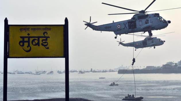 Marine commandos demonstrate rescue operation during Navy Day celebration at Gateway of India. (Pratham Gokhale/HT PHOTO)