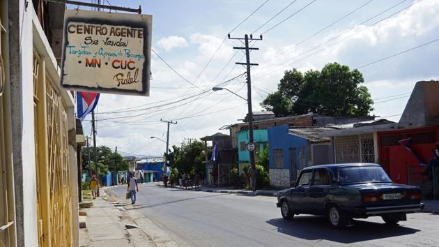 People make their way along Raul Perozo Avenue, near Santa Ifigenia cemetery where Fidel Castro's ashes will be buried, in Santiago, Cuba. For years, rumours have circulated about construction of a grand tomb for revolutionary leader Fidel Castro, the details kept so tightly secret that even a day before his burial few knew anything beyond the name of the cemetery. (AP) People make their way along Raul Perozo Avenue, near Santa Ifigenia cemetery where Fidel Castro's ashes will be buried, in Santiago, Cuba. For years, rumours have circulated about construction of a grand tomb for revolutionary leader Fidel Castro, the details kept so tightly secret that even a day before his burial few knew anything beyond the name of the cemetery. (AP)