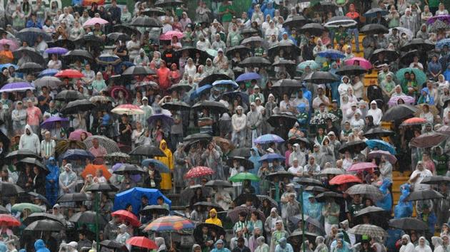 People await under the rain for the arrival of the cortege with the coffins of the members of the Chapecoense Real football club team killed in a plane crash in Colombia, at the stadium in Chapeco, Santa Catarina, southern Brazil. (AFP Photo) People await under the rain for the arrival of the cortege with the coffins of the members of the Chapecoense Real football club team killed in a plane crash in Colombia, at the stadium in Chapeco, Santa Catarina, southern Brazil. (AFP Photo)