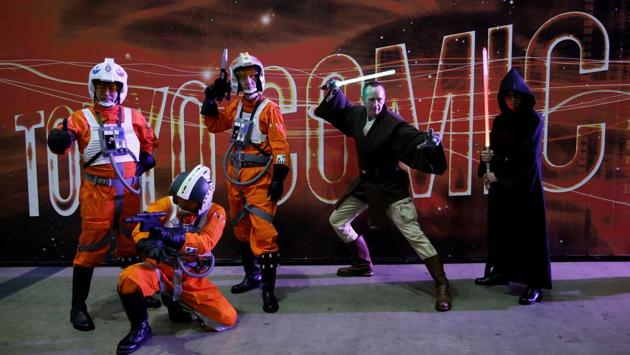 Men dressed in Star Wars characters' costumes pose for a photograph at Tokyo Comic Con. (REUTERS)