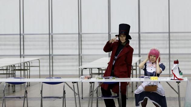 Visitors dressed as pop-culture characters pose for a photograph at Tokyo Comic Con. (REUTERS)
