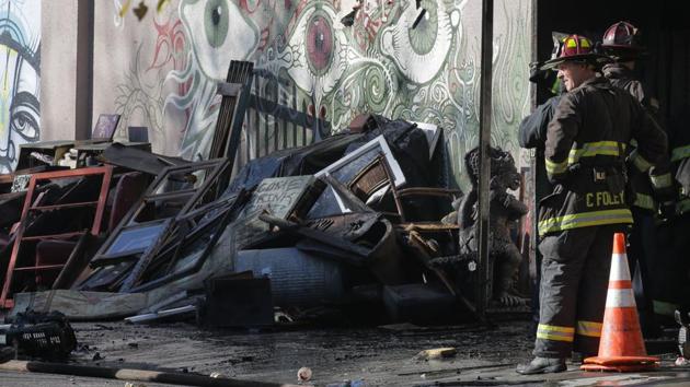 Firefighters work at the scene following an overnight fire that claimed the lives of at least nine people at a warehouse in the Fruitvale neighborhood on December 3, 2016 in Oakland, California. The warehouse was hosting an electronic music party. (AFP Photo) Firefighters work at the scene following an overnight fire that claimed the lives of at least nine people at a warehouse in the Fruitvale neighborhood on December 3, 2016 in Oakland, California. The warehouse was hosting an electronic music party. (AFP Photo)