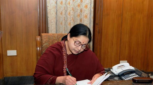 Chennai: AIADMK supremo J Jayalalithaa signs a document after swearing-in as Chief Minister of Tamil Nadu at Fort St George in Chennai on Monday. PTI Photo by R Senthil Kumar (PTI5_16_2011_000238B) (PTI) 
