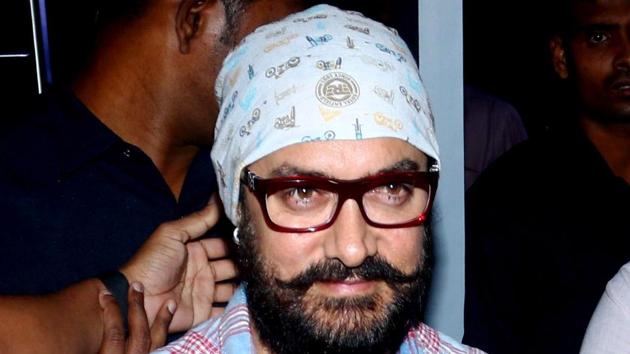Aamir Khan poses for a photograph during a promotional event in Mumbai.(AFP)
