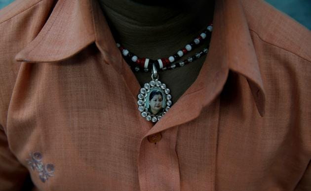 A supporter wears a locket with a picture of Tamil Nadu chief minister Jayalalithaa. (AP)