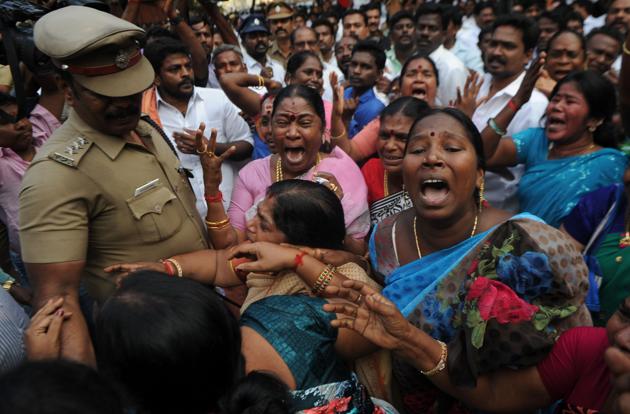 Jayalalithaa was readmitted to the critical care unit (CCU) of Chennai’s Apollo Hospital after she suffered a cardiac arrest on Sunday evening. Here supporters react for the rumours about her health. (AFP)