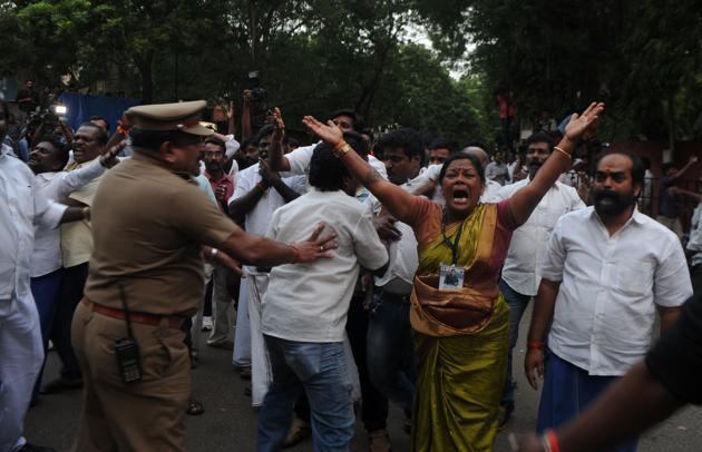 Supporters of Tamil Nadu chief minister Jayalalithaa react outside the hospital where she is being treated after false reports that she had died. (AFP)