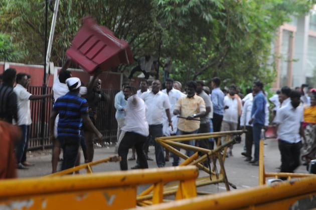 Supporters of Tamil Nadu chief minister Jayalalithaa react outside the hospital where she is being treated after false reports that she had died. (AFP)