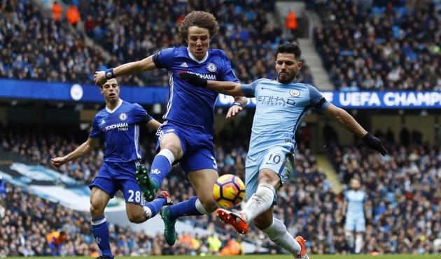 Manchester City's Sergio Aguero in action with Chelsea's David Luiz during their Premier League encounter.(REUTERS)