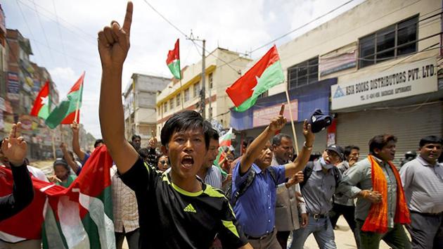 In this file photo from August 2016, protesters chant slogans as they march on a road during a general strike organised by a 30-party alliance led by a hardline faction of former Maoist rebels, who are protesting against the draft of the new constitution, in Kathmandu. In this file photo from August 2016, protesters chant slogans as they march on a road during a general strike organised by a 30-party alliance led by a hardline faction of former Maoist rebels, who are protesting against the draft of the new constitution, in Kathmandu.