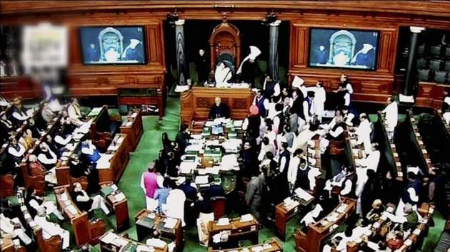 Opposition party MPs crowd in the well of the Lok Sabha protesting against demonetisation. The opposition started a debate on demonetisation in the Rajya Sabha at the start of the winter session, but took the disruption route the very next day.(PTI Photo)
