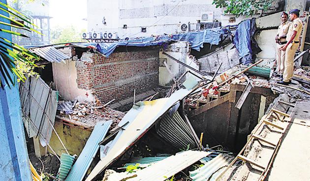 Demolition of Satyam Lodge in Thane revealed secret cubicles and escape routes.(HT photo)