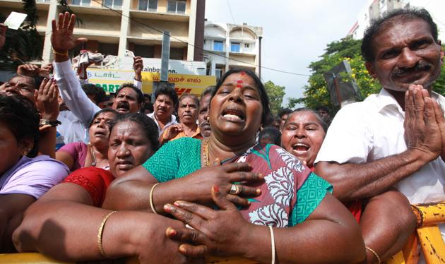 Supporters of Tamil Nadu chief minister Jayalalithaa react outside the hospital where she is being treated after false reports that she had died. (Srinivasulu/ HT Photo)