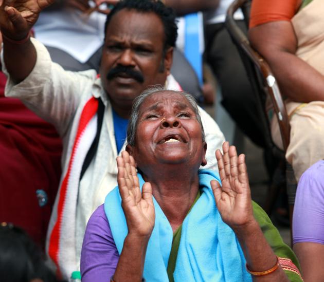 Supporters of Tamil Nadu?chief minister Jayalalithaa react outside the hospital where she is undergoing treatment after cardiac arrest on Sunday. (Srinivasulu/ HT Photo)