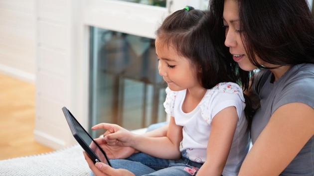 Children who are at risk for low comprehension, benefit from having an adult read with them. (Shutterstock) Children who are at risk for low comprehension, benefit from having an adult read with them. (Shutterstock)