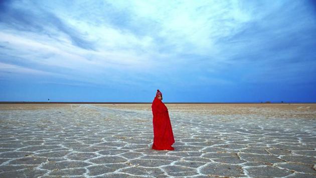 The Mesr desert, about 305 miles (500 kilometers) southeast of Tehran, is a desert and also an oasis located in central Iran. An Iranian woman covers herself with a blanket due to the cold, while visiting Khour salt lake in the desert. (AP)