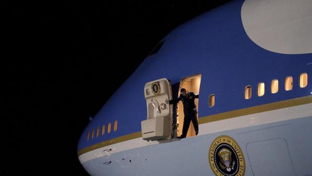 An Air Force officer opens the door of Air Force One as US President Barack Obama arrives at Joint Base Andrews from New Jersey and New York, in Maryland.(Reuters File Photo)