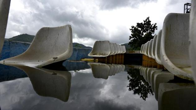 Marooned in its past: A boat filled with water lying at Palghar. (Arijit Sen/HT PHOTO) 