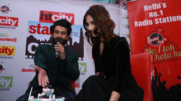 The actors had a gala time cutting cake brought by their fans for the event.  (AMAL KS /HT Photo) 