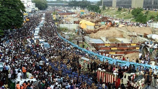 The final journey was lead by a rapid action force and Tamil Nadu police personnel who formed a human chain to protect the hearse from thousands of supporters who had come to pay their tributes. (PTI) The final journey was lead by a rapid action force and Tamil Nadu police personnel who formed a human chain to protect the hearse from thousands of supporters who had come to pay their tributes. (PTI)