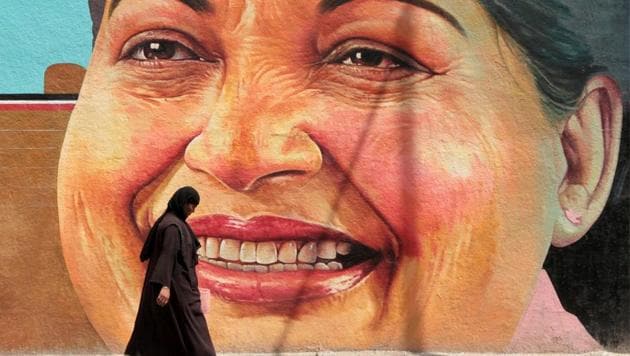 A woman walks past a portrait of J. Jayalalithaa, Chief Minister of the southern state of Tamil Nadu, in Chennai, India, March 13, 2012. REUTERS/Babu/File Photo TPX IMAGES OF THE DAY(REUTERS)