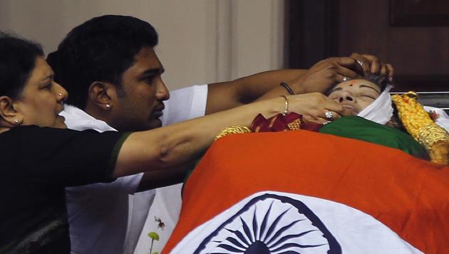 Former chief minister Jayaram Jayalalithaa’s body is kept for public viewing outside an auditorium in Chennai, on December 6, 2016.(AP)